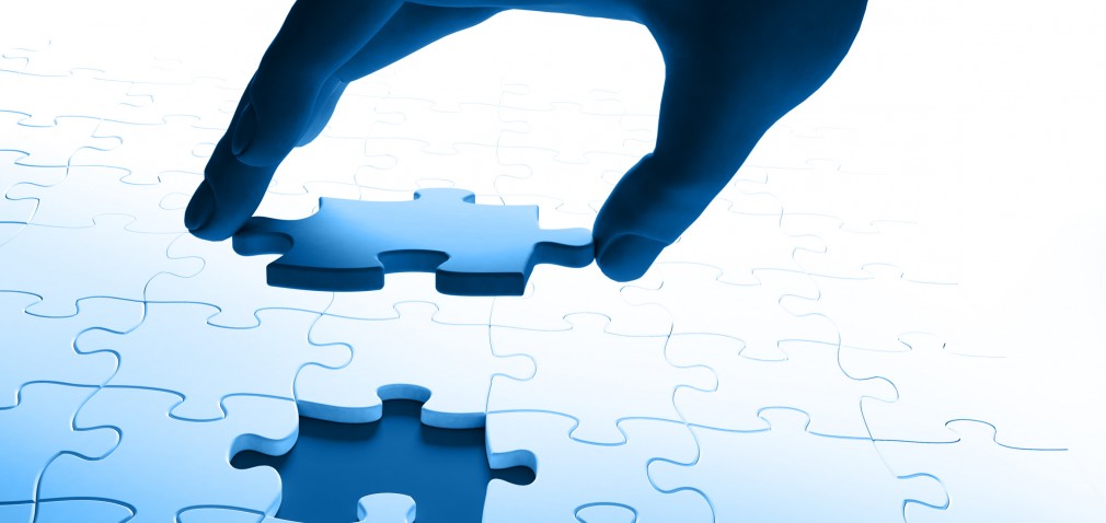 hand joining a puzzle hand joining a puzzle